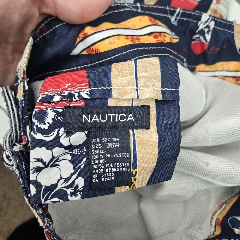 Nautica Blue and Red Swim Trunks with Surfboard Design